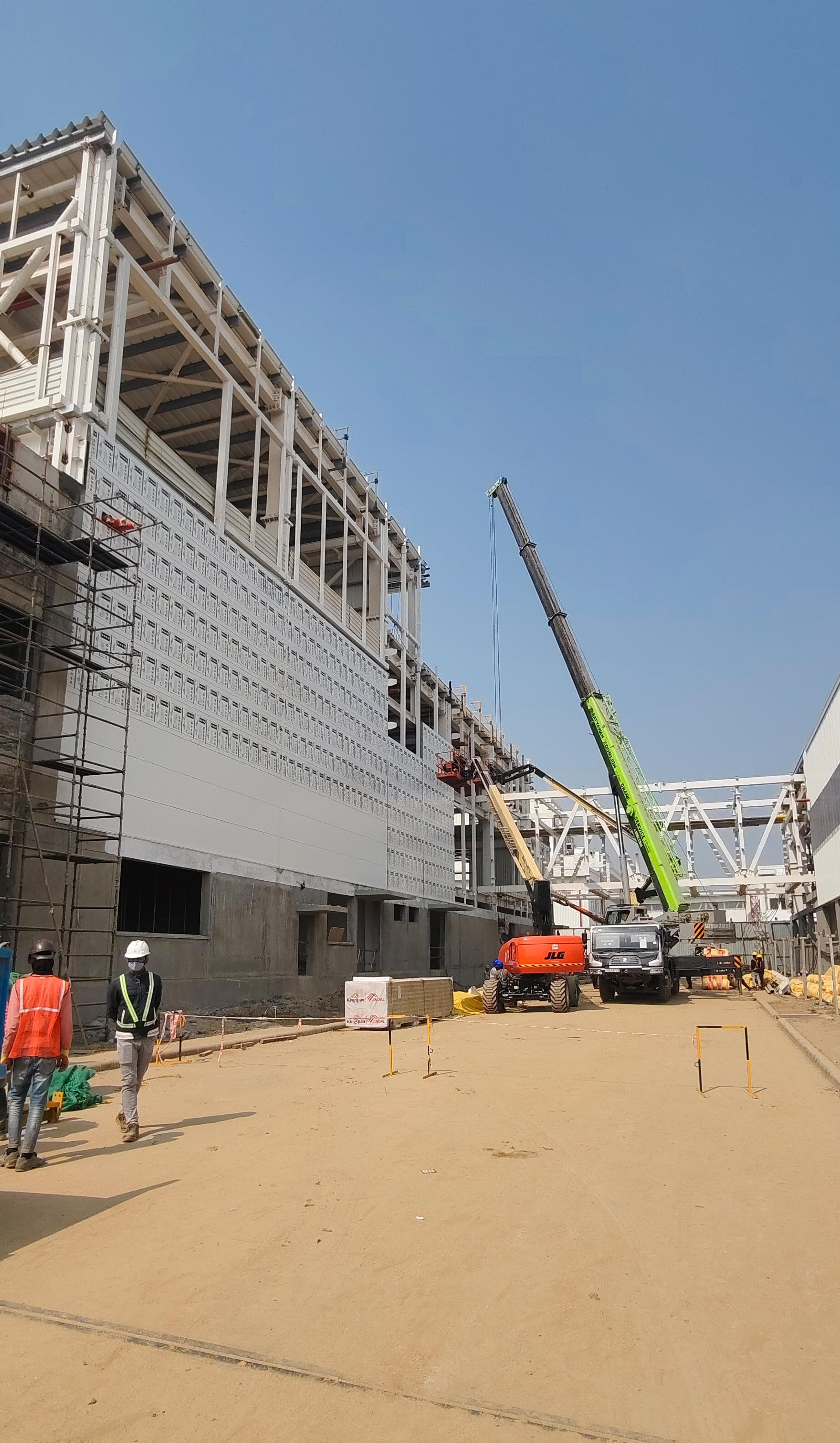 Large industrial construction site with panel cladding